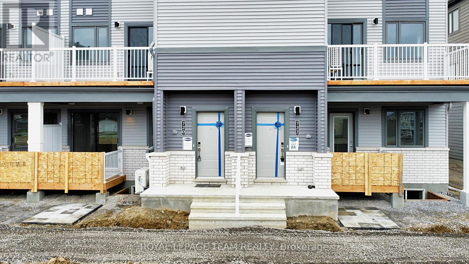 A row of houses with the word REALTOR on the front.