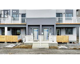 A row of houses with the word REALTOR on the front.