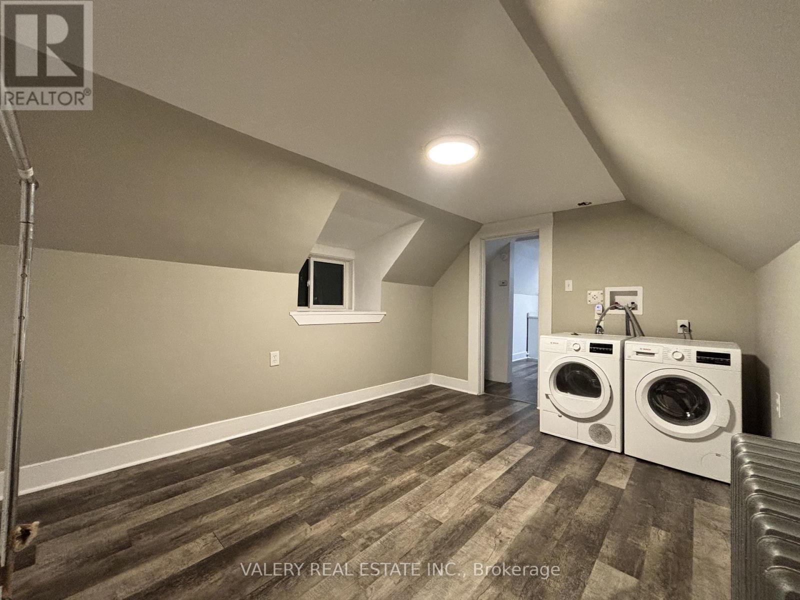 A laundry room with a washer and dryer.