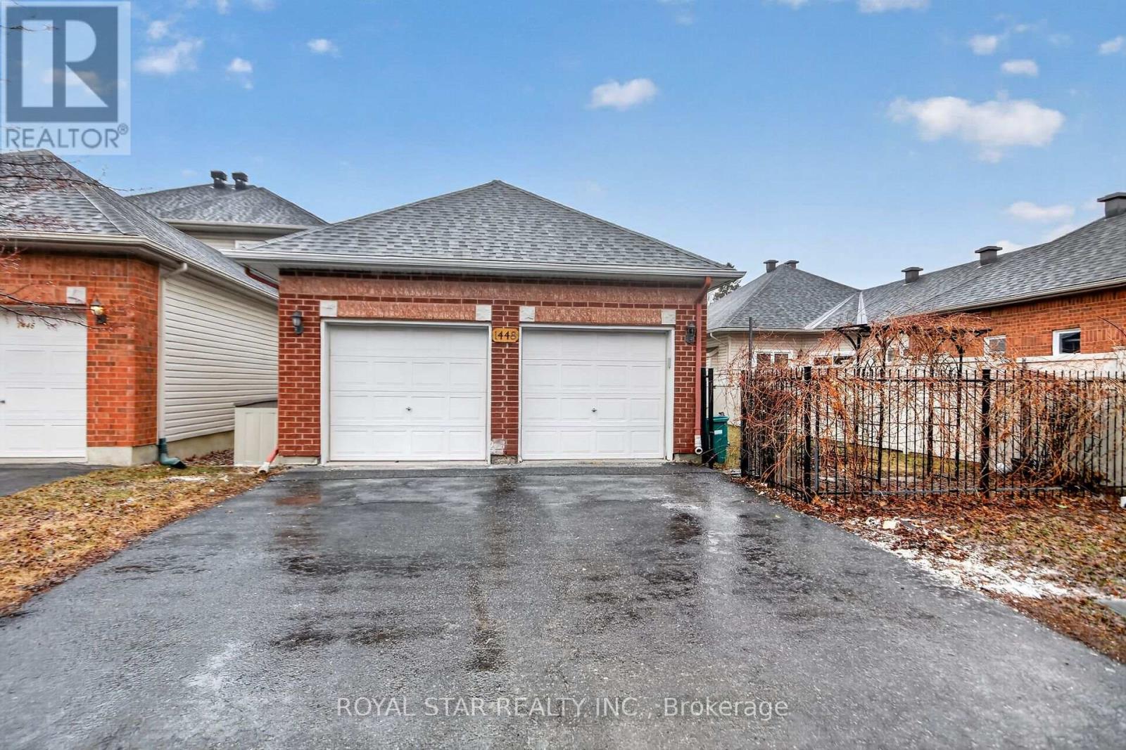 A house with a garage is for sale.