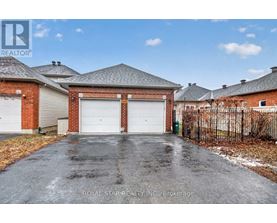 A house with a garage is for sale.