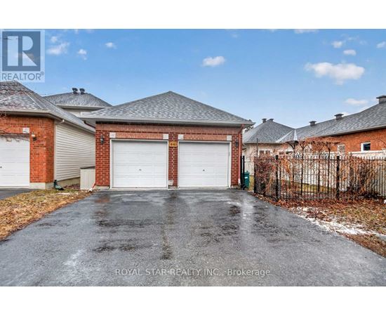 A house with a garage is for sale.