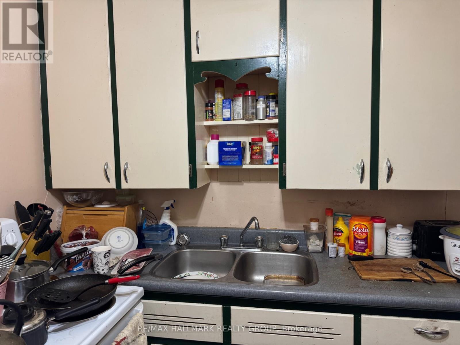 A kitchen with a sink and cabinets.