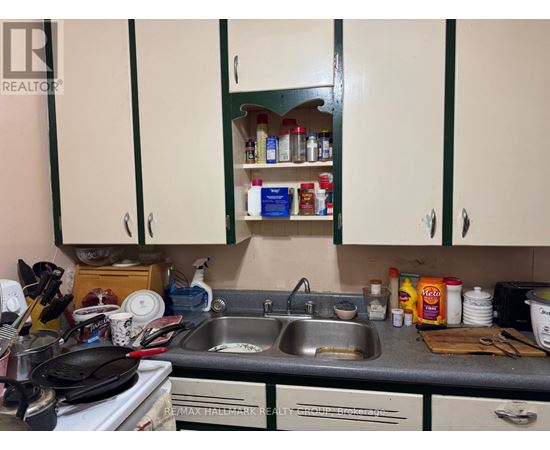 A kitchen with a sink and cabinets.