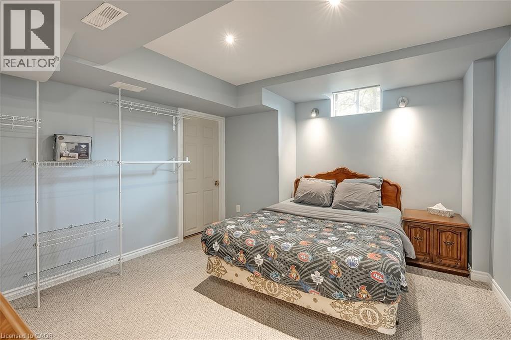 A bedroom with a large bed and a built-in closet.