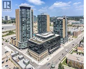 A cityscape with buildings and a clear sky.