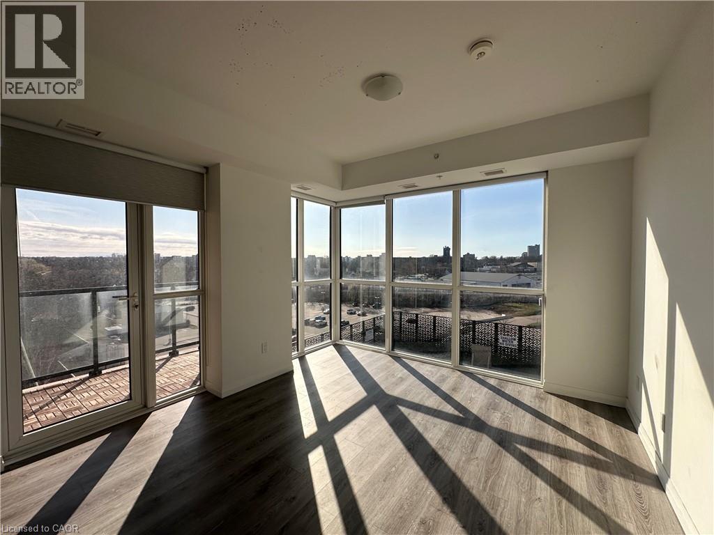 A sunny day in a spacious room with a view of the cityscape.