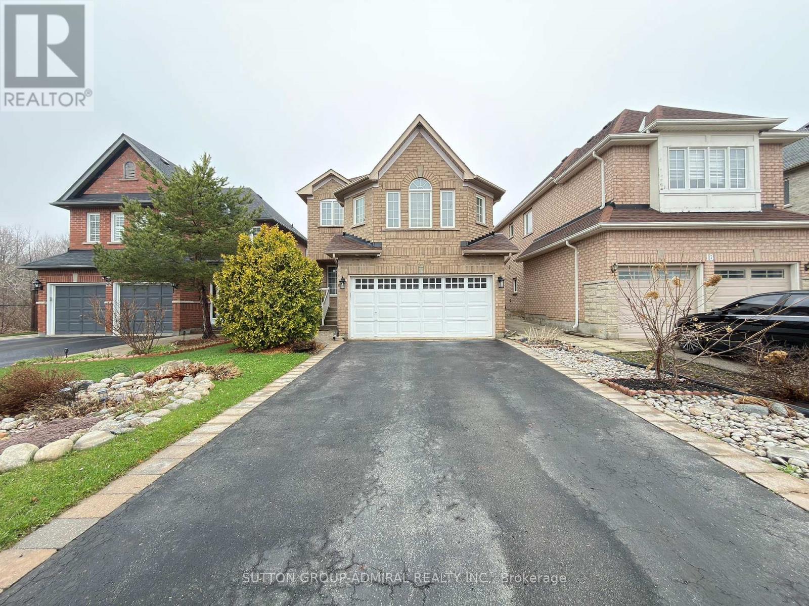 A house with a driveway in front of it.