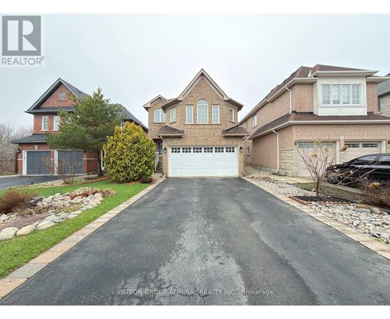 A house with a driveway in front of it.
