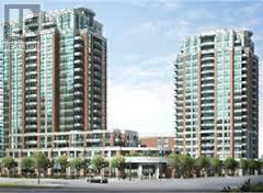 Two large buildings with balconies are in the foreground.