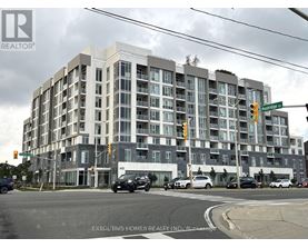 A multi-story building with a grey facade and a sign that reads "REALTOR" on the top left corner.
