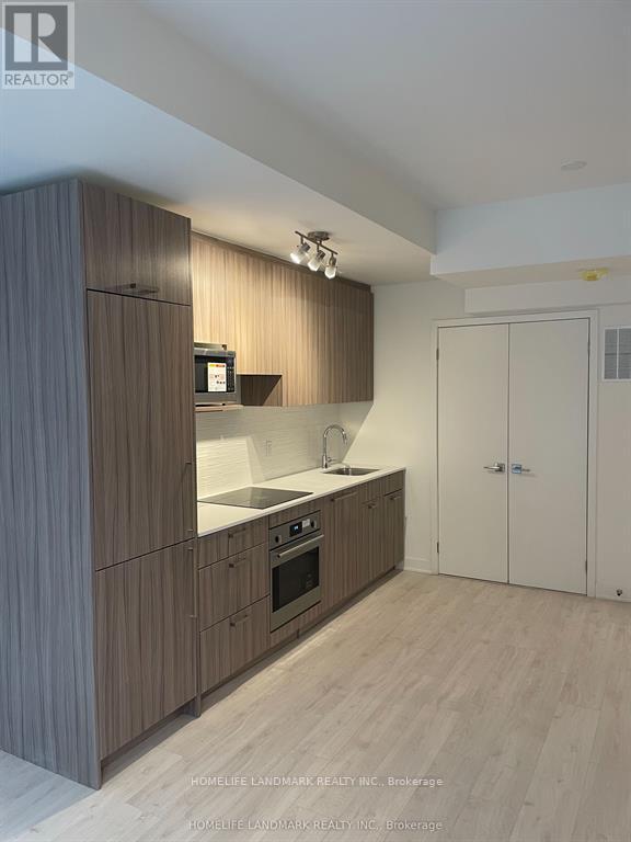 A modern kitchen with wooden cabinets and a white countertop.