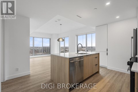 A modern kitchen with wooden cabinets and a large window overlooking the city.