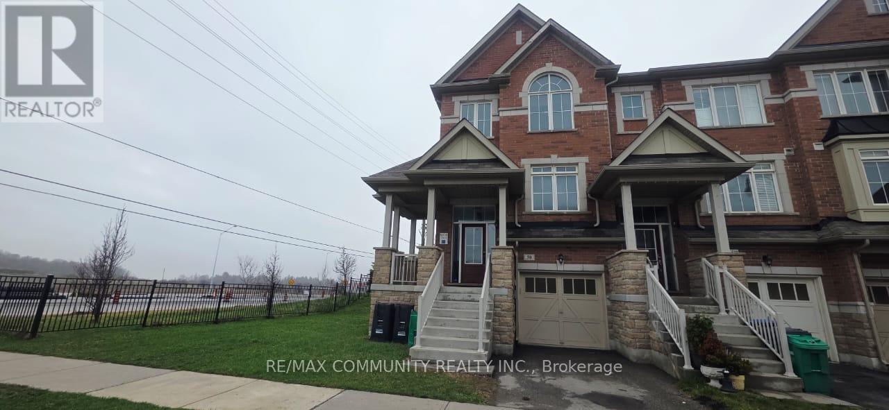 A house with a brown brick facade and a white trim is for sale.