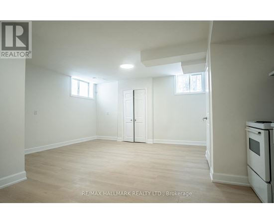A white room with a door and a window.