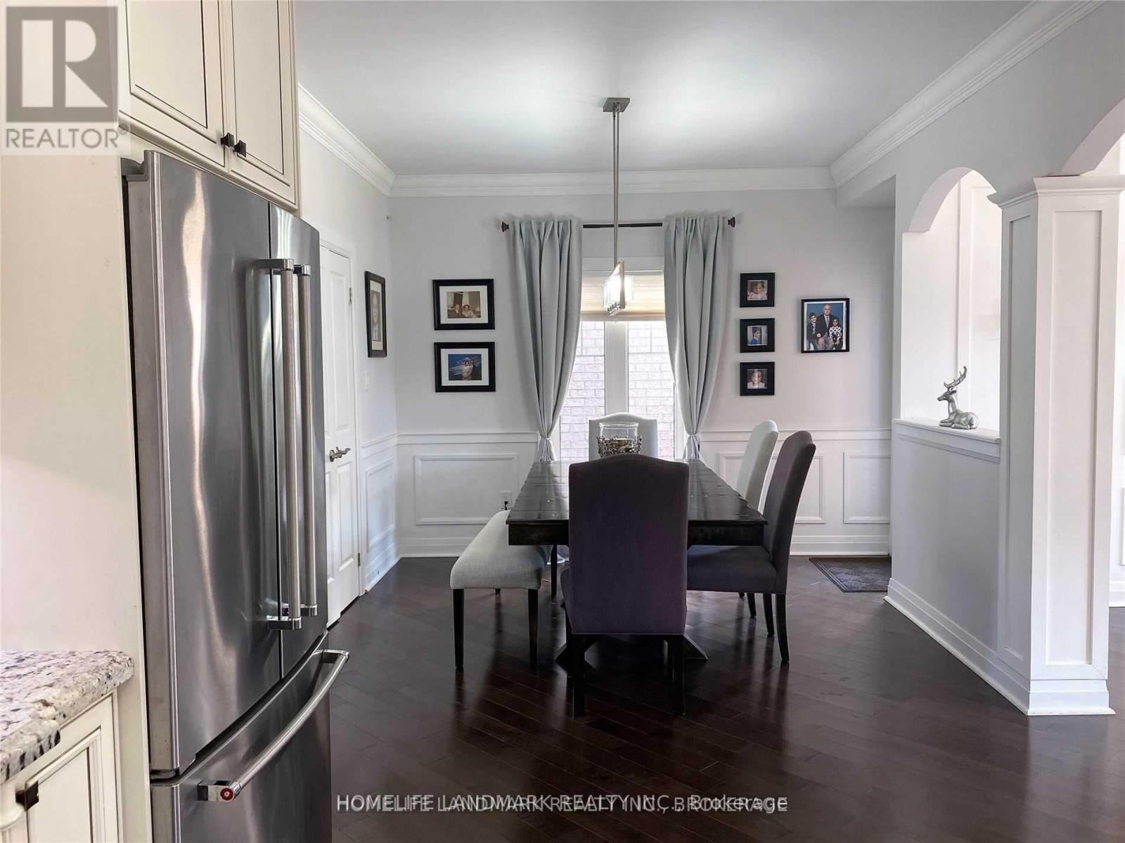 A kitchen with a table and chairs in the middle of the room.