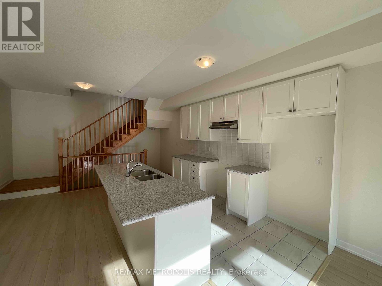 A kitchen with a counter top and cabinets.