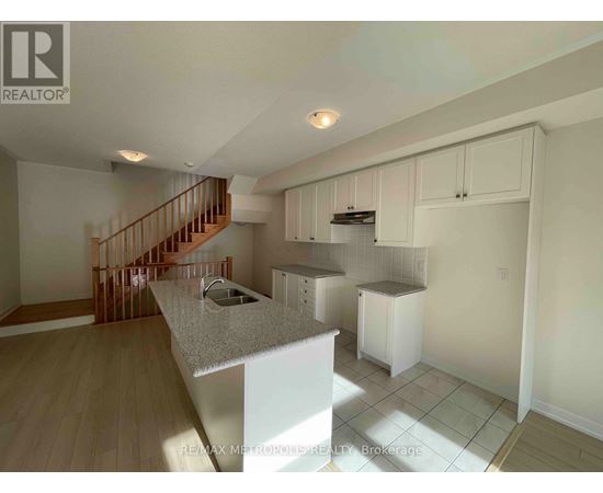 A kitchen with a counter top and cabinets.