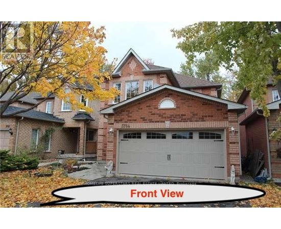 A house with a front view and a garage.