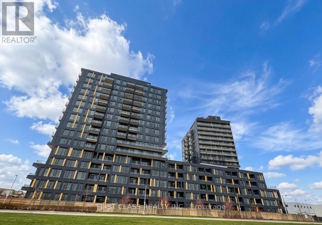 A modern building complex with a clear blue sky above.