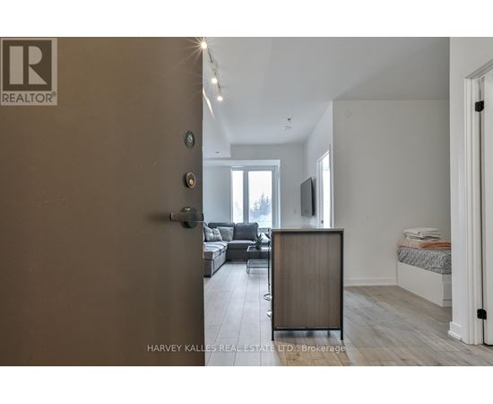 A realtor logo is on the door of a room.