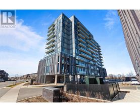 A modern multi-story building with a glass facade is under construction.