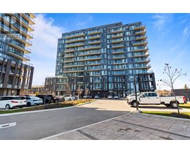 A modern multi-story building with a glass facade is the focal point of the image.