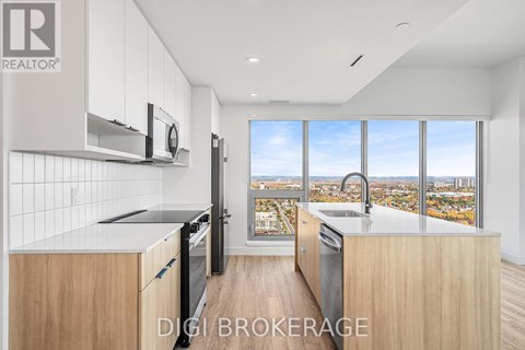 A modern kitchen with wooden cabinets and stainless steel appliances.