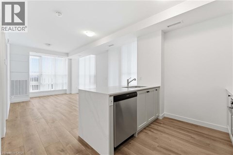 A kitchen with a sink and a dishwasher.