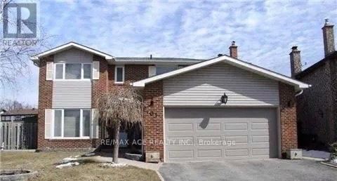 A house with a garage is for sale.