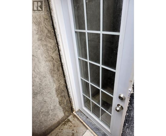 A white door with glass panes and a handle.