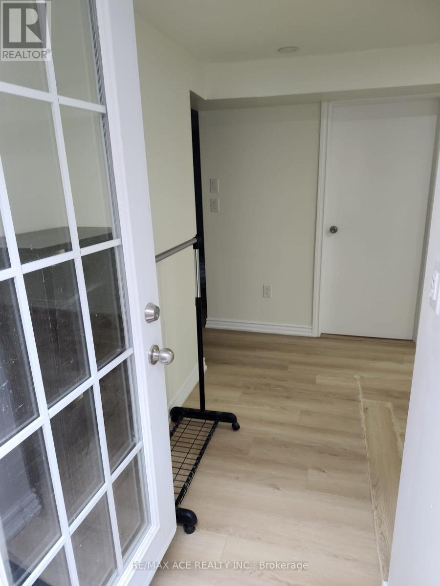 A brokerage sign is on the door.