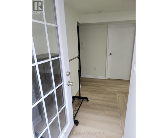 A brokerage sign is on the door.