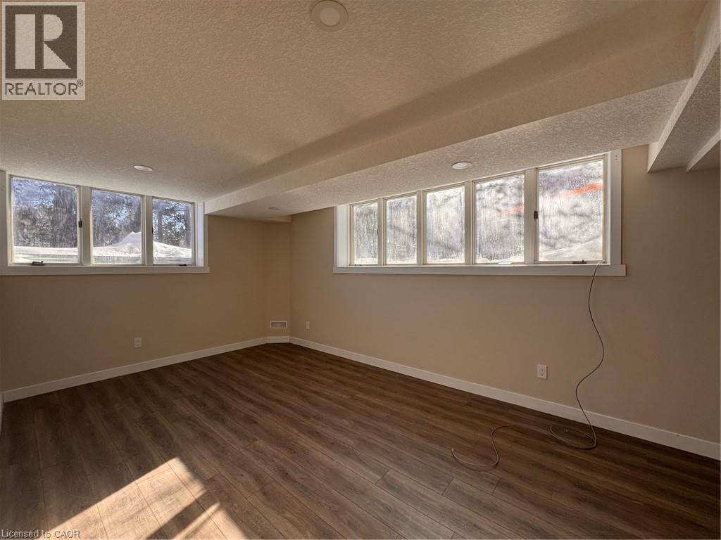 A room with a window showing a snowy landscape outside.