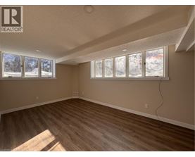 A room with a window showing a snowy landscape outside.