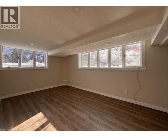 A room with a window showing a snowy landscape outside.