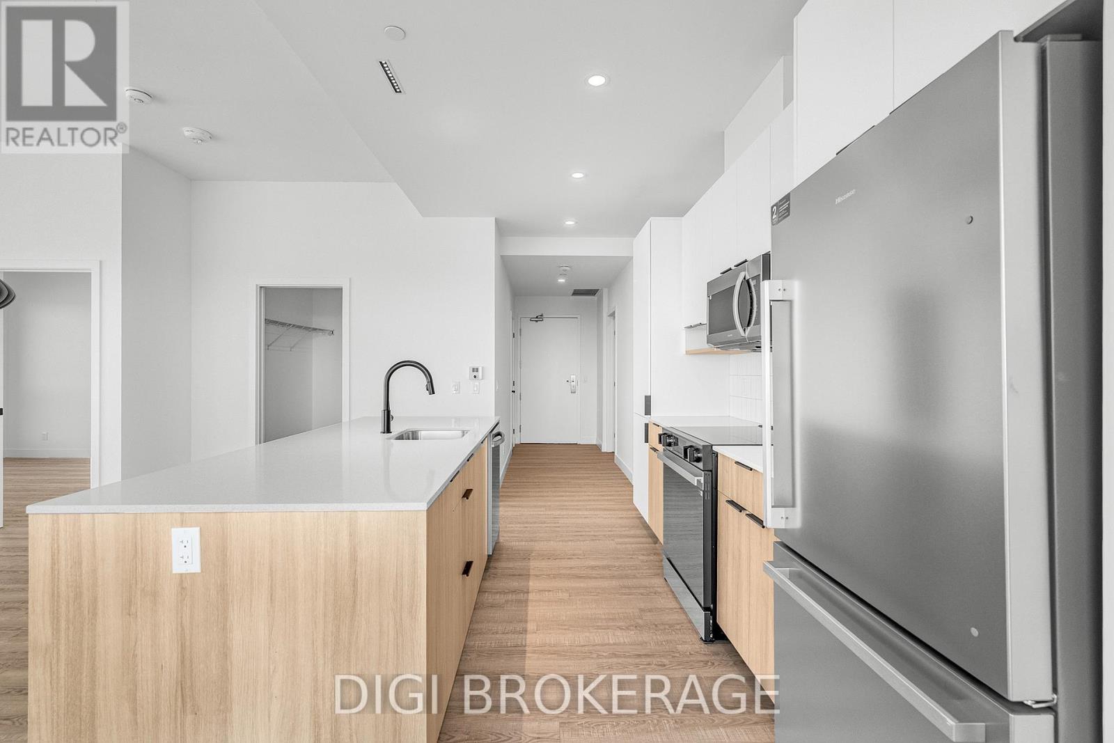 A modern kitchen with a stainless steel refrigerator and wooden countertops.