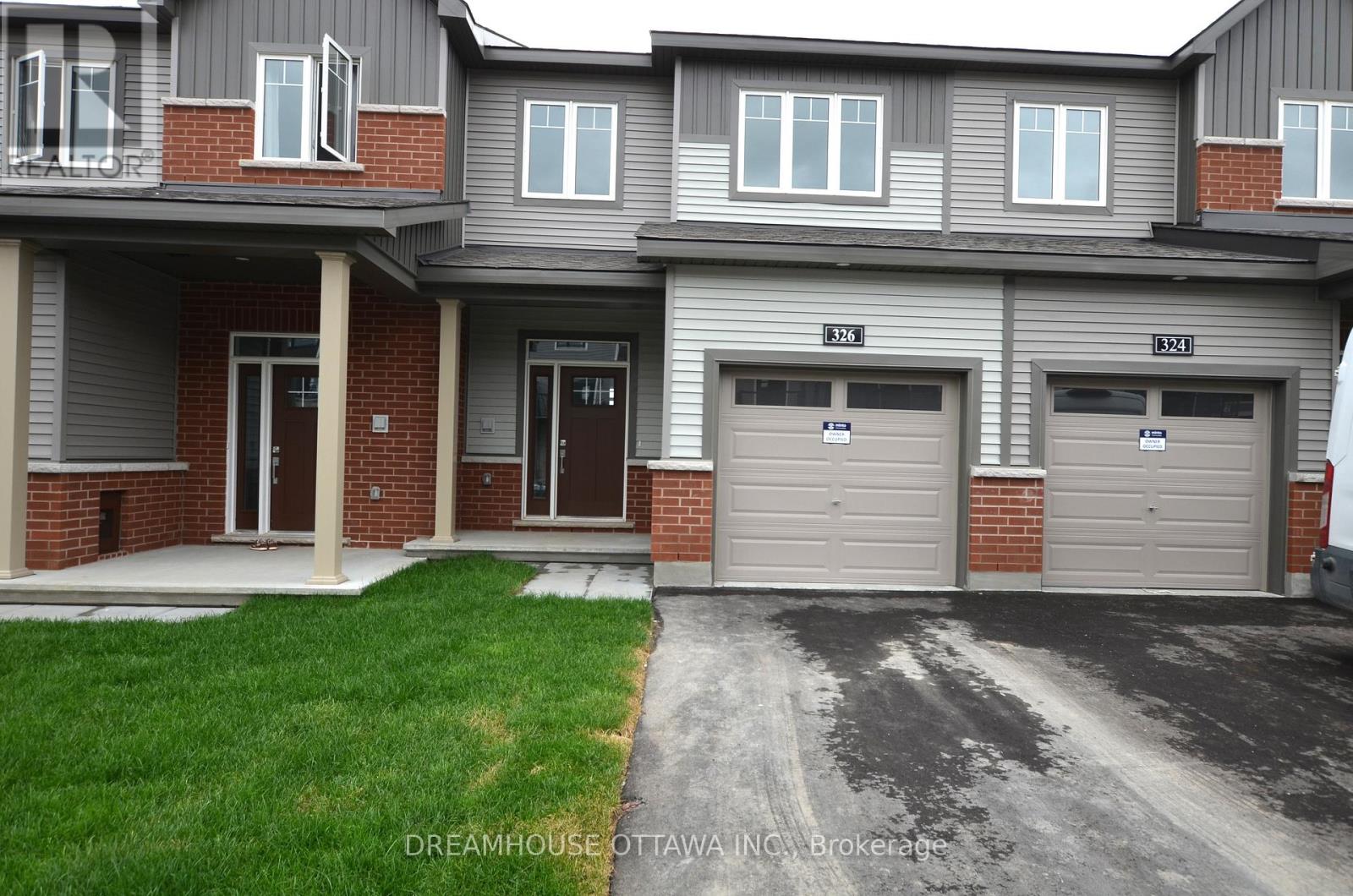 A grey and red building with the words REALTOR on the top left.