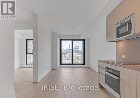 A modern kitchen with a microwave above the stove.