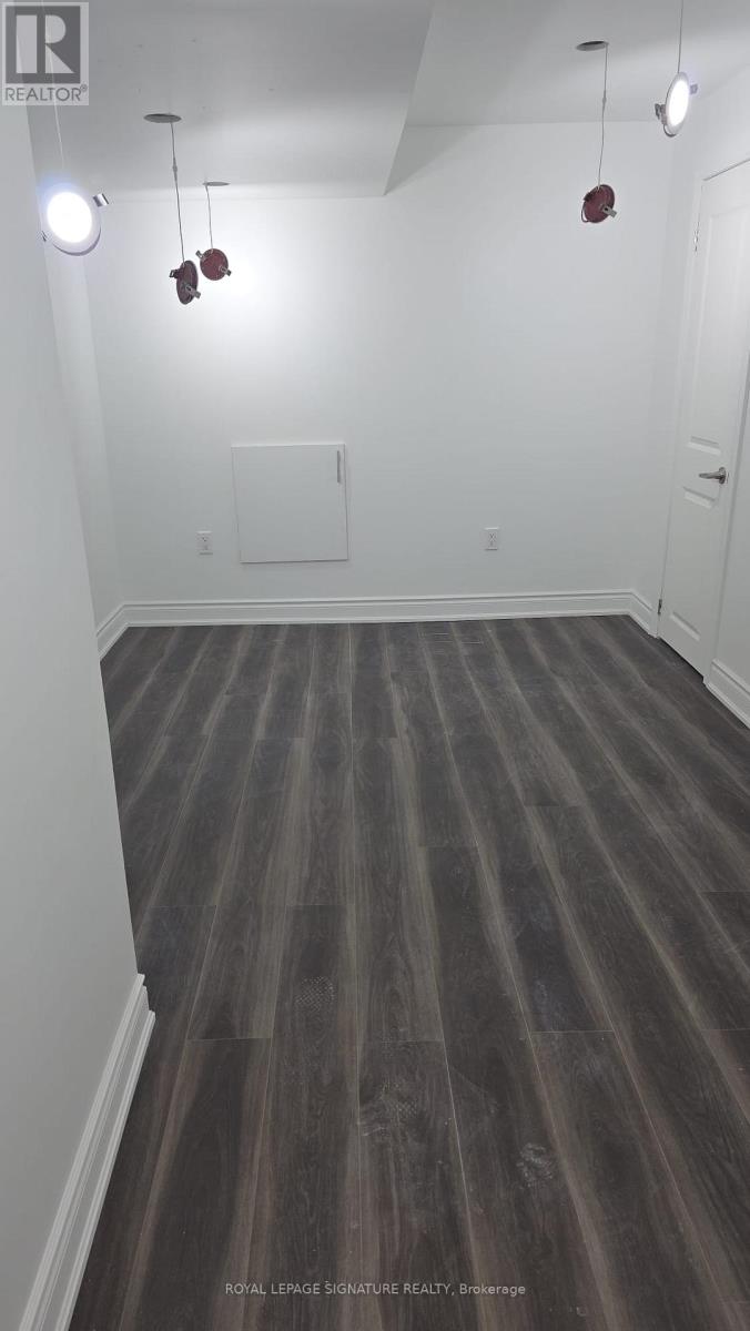 A room with wooden floors and white walls.