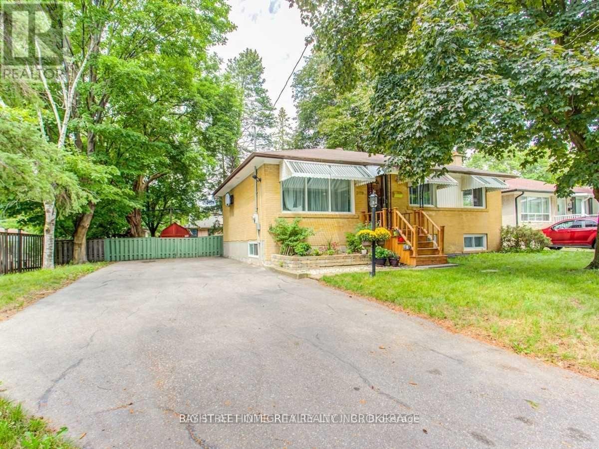 A house with a driveway in front of it.