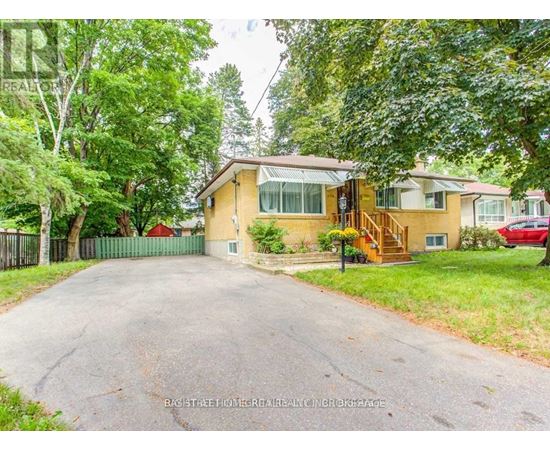 A house with a driveway in front of it.