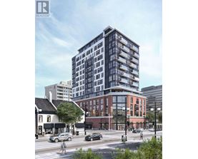 A rendering of a modern glass building in a city setting.