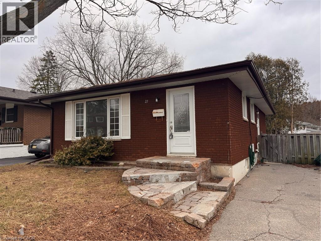 A house with a white door and windows is for sale.