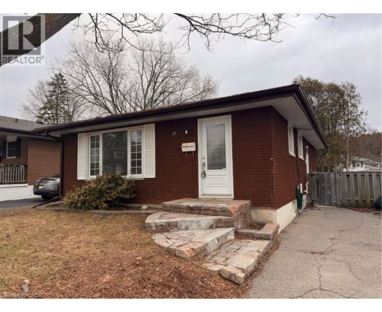 A house with a white door and windows is for sale.