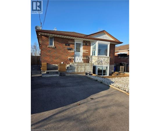 A house with a brick exterior and a garage.