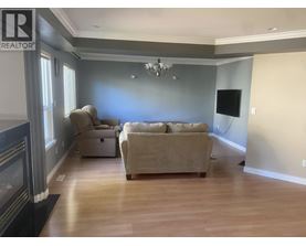 A living room with a fireplace and a couch.