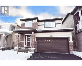 A house with a brown garage door is for sale in Brokerage.