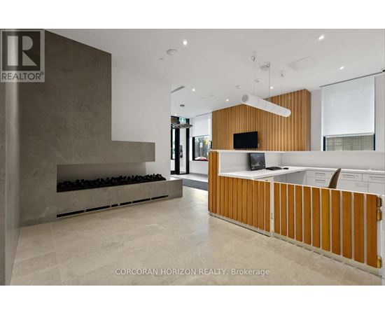 A modern living room with a fireplace and a tv.