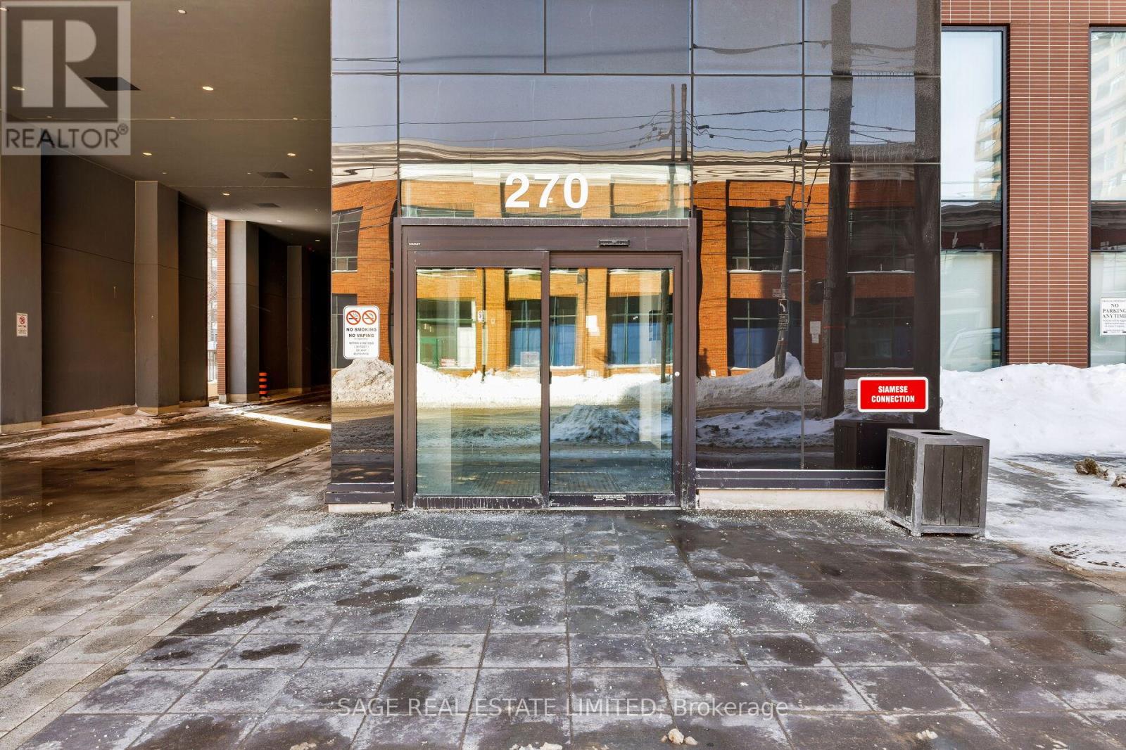 The entrance to a building with a glass door and a sign that reads "270".